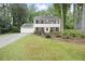 Inviting two-story home with a well-manicured lawn and attached two car garage at 4468 Whitt Station Nw Run, Acworth, GA 30101