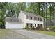 Two story home with vinyl siding, with shutters and a two car attached garage at 4468 Whitt Station Nw Run, Acworth, GA 30101