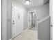 Bright foyer with tile floors, white door with decorative glass, and neutral gray walls at 4468 Whitt Station Nw Run, Acworth, GA 30101