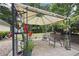 Relaxing gazebo area with comfortable seating and lush greenery, perfect for outdoor entertaining at 4468 Whitt Station Nw Run, Acworth, GA 30101