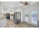 The kitchen has stainless steel appliances and a door to access the patio at 4468 Whitt Station Nw Run, Acworth, GA 30101