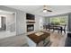 Living and dining area with fireplace and a sliding glass door leading to the outside at 4468 Whitt Station Nw Run, Acworth, GA 30101