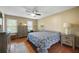 Inviting bedroom features hardwood floors, neutral walls, desk, and plenty of natural light at 4468 Whitt Station Nw Run, Acworth, GA 30101