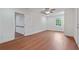 Bright bedroom with hardwood floors, a ceiling fan, and natural light from window at 472 Rigby Ne St, Marietta, GA 30060