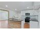 Modern kitchen with white cabinets, stainless steel appliances, and a stylish center island at 472 Rigby Ne St, Marietta, GA 30060