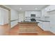 Modern kitchen featuring white cabinets, stainless steel appliances, and a center island at 472 Rigby Ne St, Marietta, GA 30060