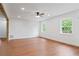 Bright living room featuring hardwood floors, natural light and neutral walls at 472 Rigby Ne St, Marietta, GA 30060