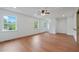 Well-lit living room showcasing hardwood floors, with a doorway and several windows at 472 Rigby Ne St, Marietta, GA 30060