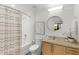 Neutral bathroom with shower-tub combination, a striped shower curtain, and a granite countertop at 563 Memorial Dr # 211, Atlanta, GA 30312