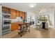 Open concept kitchen flows into the living space; features stainless steel appliances and concrete ceilings at 563 Memorial Dr # 211, Atlanta, GA 30312