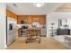 Well-lit kitchen with stainless steel appliances, wood cabinets, and open access to living area at 563 Memorial Dr # 211, Atlanta, GA 30312