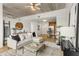 Bright living room featuring modern decor, exposed concrete ceiling, and an open floor plan at 563 Memorial Dr # 211, Atlanta, GA 30312