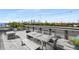 Spacious rooftop deck offering tables with bar stools, bench seating and city skyline views at 563 Memorial Dr # 211, Atlanta, GA 30312