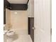 Bathroom features a tub shower and toilet at 6416 Vicksburg Nw Ct, Acworth, GA 30101