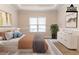 Bedroom with a modern bed, matching dressers, and a large window at 6416 Vicksburg Nw Ct, Acworth, GA 30101