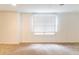 Bedroom with carpet and large window at 6416 Vicksburg Nw Ct, Acworth, GA 30101