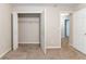 Bedroom with open closet door and another door to an adjacent room, offering ample storage and space at 6416 Vicksburg Nw Ct, Acworth, GA 30101