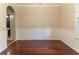 Dining room with hardwood floors, wainscoting, and an open doorway to another room at 6416 Vicksburg Nw Ct, Acworth, GA 30101