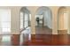 Open dining area with hardwood floors and arched doorways leading to other rooms at 6416 Vicksburg Nw Ct, Acworth, GA 30101