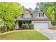 Charming two-story home with well-maintained lawn, front porch, and attached garage at 6416 Vicksburg Nw Ct, Acworth, GA 30101