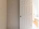 Hallway leading to bathroom with bathtub at 6416 Vicksburg Nw Ct, Acworth, GA 30101