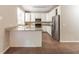 Spacious kitchen with white cabinets, stainless steel appliances, and granite countertops at 6416 Vicksburg Nw Ct, Acworth, GA 30101