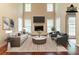Bright living room with a fireplace, hardwood floors, and modern furniture at 6416 Vicksburg Nw Ct, Acworth, GA 30101