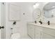 Bright bathroom featuring dual sinks, round mirrors and sleek fixtures at 1221 Oakfield Se Dr, Atlanta, GA 30316