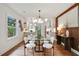 Modern dining room with stylish light fixture, seating for six, and hardwood flooring at 1221 Oakfield Se Dr, Atlanta, GA 30316