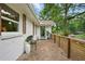 Welcoming porch with a stone floor, modern railing and bench at 1221 Oakfield Se Dr, Atlanta, GA 30316