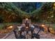 Charming outdoor fire pit area with stone surround and ambient lighting at 1221 Oakfield Se Dr, Atlanta, GA 30316