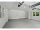 Spacious two car garage featuring windows and overhead lighting at 1221 Oakfield Se Dr, Atlanta, GA 30316