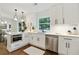 Well-lit kitchen featuring white cabinetry, stainless steel appliances, and quartz countertops at 1221 Oakfield Se Dr, Atlanta, GA 30316