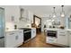 Modern kitchen with white cabinets, stainless steel appliances, hardwood floors, and great lighting at 1221 Oakfield Se Dr, Atlanta, GA 30316