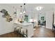 Bright kitchen with modern finishes including white cabinets, barstool seating and stainless steel appliances at 1221 Oakfield Se Dr, Atlanta, GA 30316