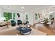 Bright living room featuring hardwood floors, natural light, and an open floor plan to the dining area at 1221 Oakfield Se Dr, Atlanta, GA 30316