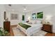 Serene bedroom with hardwood floors, ceiling fan, and ensuite access to the yard at 1221 Oakfield Se Dr, Atlanta, GA 30316