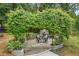 Landscaped patio area with a stone fireplace and seating at 1221 Oakfield Se Dr, Atlanta, GA 30316