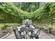 Cozy patio area with a stone fireplace and dining table at 1221 Oakfield Se Dr, Atlanta, GA 30316