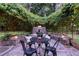 Cozy vine-covered patio with stone floor, ideal for outdoor dining and entertaining at 1221 Oakfield Se Dr, Atlanta, GA 30316