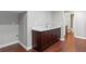 Finished basement wet bar with granite countertops, wood floors, and a view into the bathroom at 3341 Cranmore Chase, Marietta, GA 30066