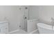 This bathroom features a glass shower, white subway tiles, and a soaking tub at 3341 Cranmore Chase, Marietta, GA 30066