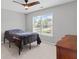 Bedroom with a ceiling fan and natural light, featuring a large window overlooking street at 3341 Cranmore Chase, Marietta, GA 30066