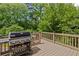 Wooden deck area with a stainless steel grill, perfect for outdoor entertaining at 3341 Cranmore Chase, Marietta, GA 30066