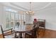 Elegant dining room featuring hardwood floors, a large window with shutters, and stylish decor at 3341 Cranmore Chase, Marietta, GA 30066