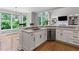 Bright kitchen with stainless steel appliances, white cabinets, and an adjacent breakfast nook at 3341 Cranmore Chase, Marietta, GA 30066