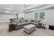Spacious living room featuring a comfortable sectional sofa, ottoman, and a pool table at 3341 Cranmore Chase, Marietta, GA 30066