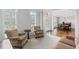 Comfortable living room with bright windows, neutral decor, and seamless access to the dining area at 3341 Cranmore Chase, Marietta, GA 30066