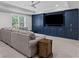 Spacious living room features custom built-ins, modern lighting, and plush furniture at 3341 Cranmore Chase, Marietta, GA 30066