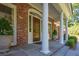 Close-up of a distinguished front door with white columns and detailed trim, adding a touch of elegance at 3845 Parian Nw Rdg, Atlanta, GA 30327